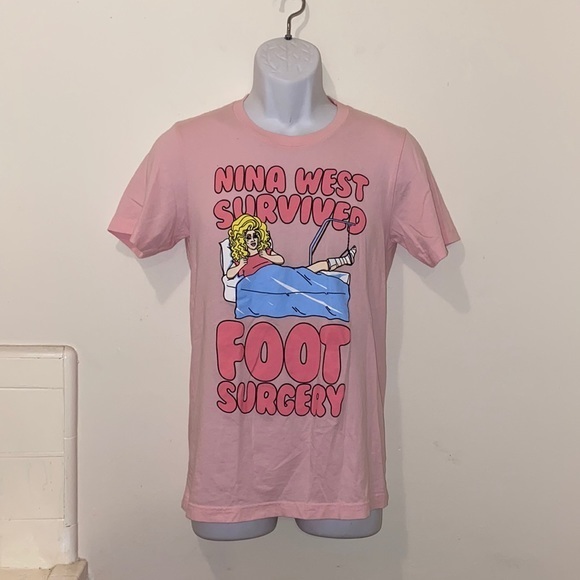Unisex Pink Nina West “Survived Foot Surgery” Tee - Picture 1 of 8